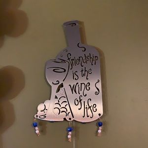 Metal “friendship is the wine of life” wall hanging